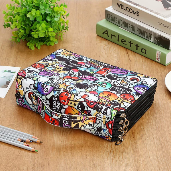 A zippered fabric pouch with a colorful cartoon graffiti print, displayed on a wooden tabletop with books, pencils, and a plant.
