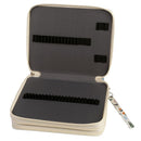 An open zippered hard case with a cream-colored exterior and dark gray interior padding, featuring black elastic loops and a small attached patterned wrist strap on a white background.