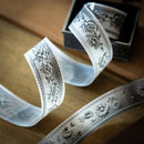 Decorative ribbon with floral patterns on a wooden surface