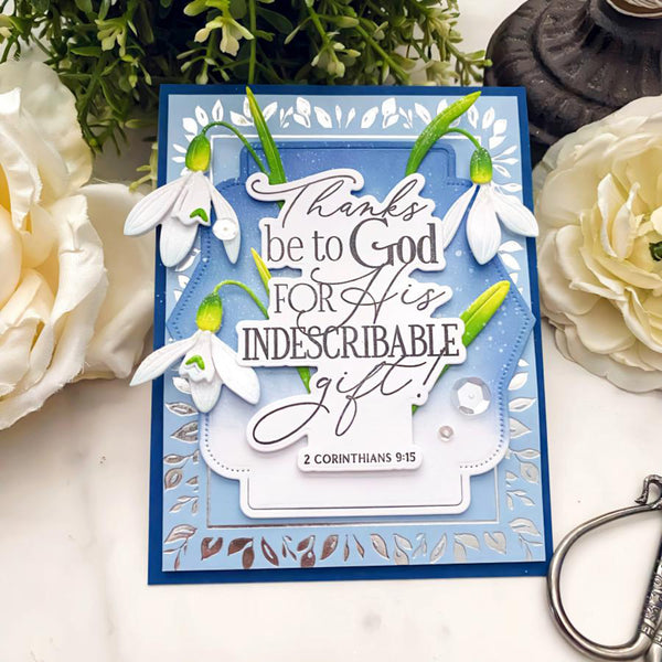 Greeting card with floral design and text, surrounded by flowers and a candle.