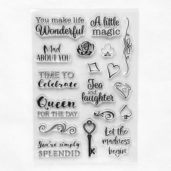 A sheet of clear acrylic or rubber stamp designs featuring various quote phrases, hearts, diamonds, clubs, spades, roses, and decorative flourishes on a white background.
