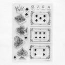 A sheet of clear acrylic or rubber stamps featuring black playing card suit and face designs, including a crown, hearts, diamonds, clubs, and card suits, arranged on a white background.