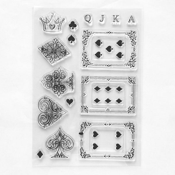 A sheet of clear acrylic or rubber stamps featuring black playing card suit and face designs, including a crown, hearts, diamonds, clubs, and card suits, arranged on a white background.