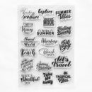 A sheet of clear acrylic or rubber stamps with multiple black travel-themed quote designs, including phrases like 'Summer Vibes,' 'Beach Days,' 'Adventure Awaits,' and 'Let's Travel,' shown on a plain white background.