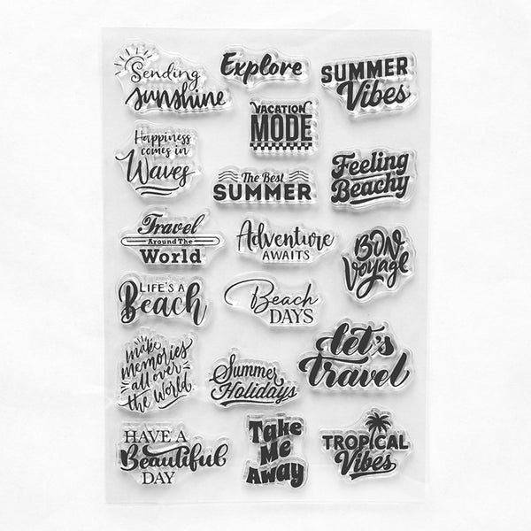 A sheet of clear acrylic or rubber stamps with multiple black travel-themed quote designs, including phrases like 'Summer Vibes,' 'Beach Days,' 'Adventure Awaits,' and 'Let's Travel,' shown on a plain white background.