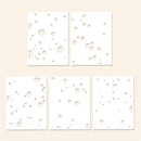 Four white square filters with circular patterns on a beige background