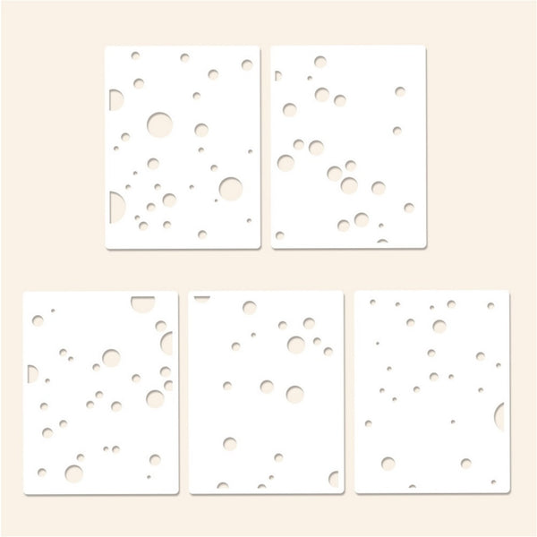 Four white square filters with circular patterns on a beige background