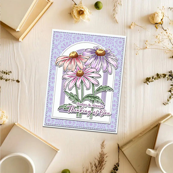 Floral card with 'Today & Always Thinking of You' text on a wooden surface with flowers and books.