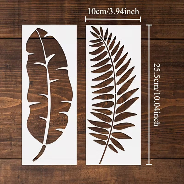 Two white stencil sheets with leaf cutouts displayed on a dark wood background, with measurement lines and text indicating dimensions of 10cm/3.94inch by 25.