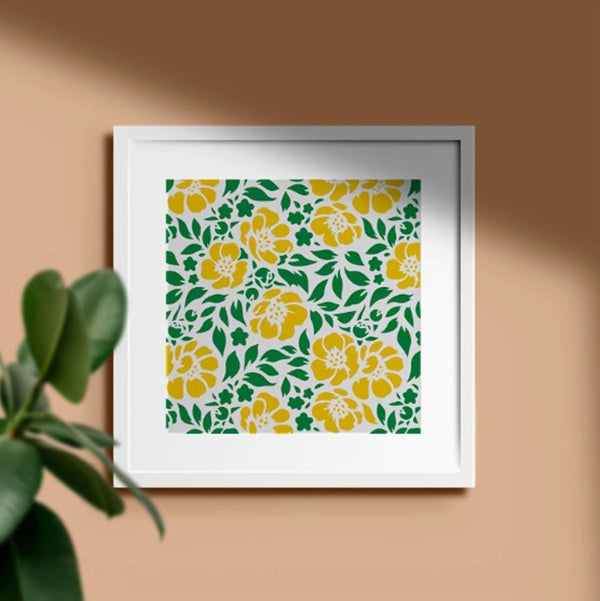 Framed artwork with yellow floral pattern on a beige wall