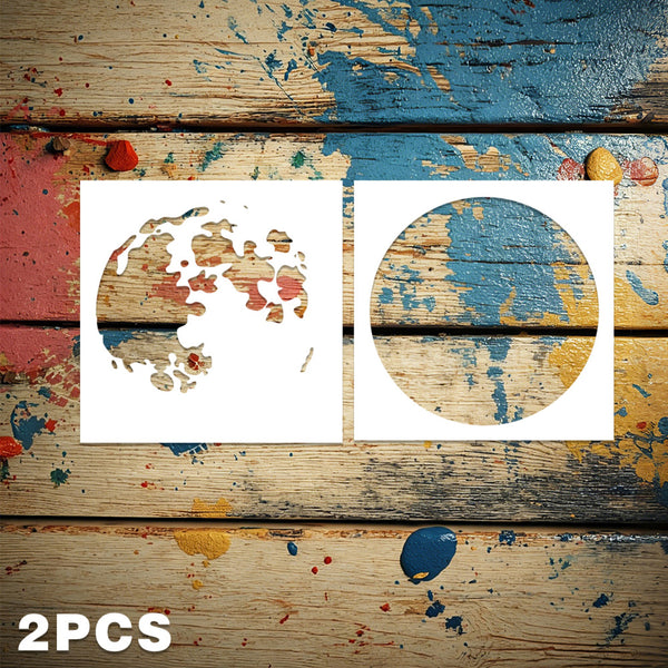 Two white circular stencil templates displayed on a rustic, paint-splattered wooden background, with '2PCS' text in the bottom-left corner.