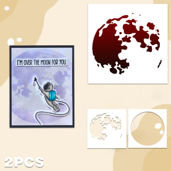 A 2-piece craft stencil set featuring a moon silhouette stencil and a circular moon stencil, shown alongside a framed watercolor art print of an astronaut floating over a purple moon with the text 'I'M OVER THE MOON FOR YOU'. The background is a light beige with abstract shapes.