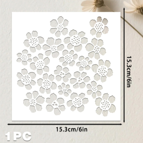 A white square stencil or template with a repeating floral cutout pattern, shown on a light textured background. Black measurement lines and text indicate dimensions of 15.