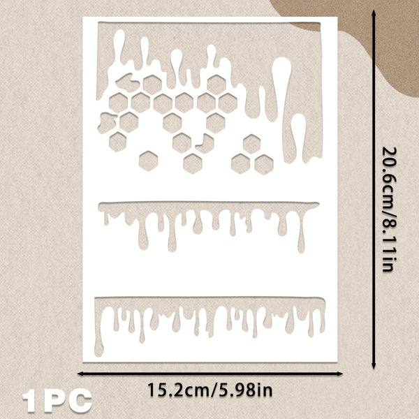 A white rectangular stencil sheet with three dripping and hexagon cutout patterns, shown on a beige textured background with printed dimensions 15.2cm by 20.