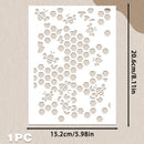 A white rectangular stencil or decorative panel with a repeating honeycomb and bee cutout pattern, shown on a beige textured background with printed dimensions of 15.2 cm by 20.