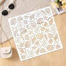 A square white decorative stencil or craft sheet with cutout seashell, starfish, and floral motifs, photographed on a light wood surface with sunglasses, a small purse, and flowers as styled props.