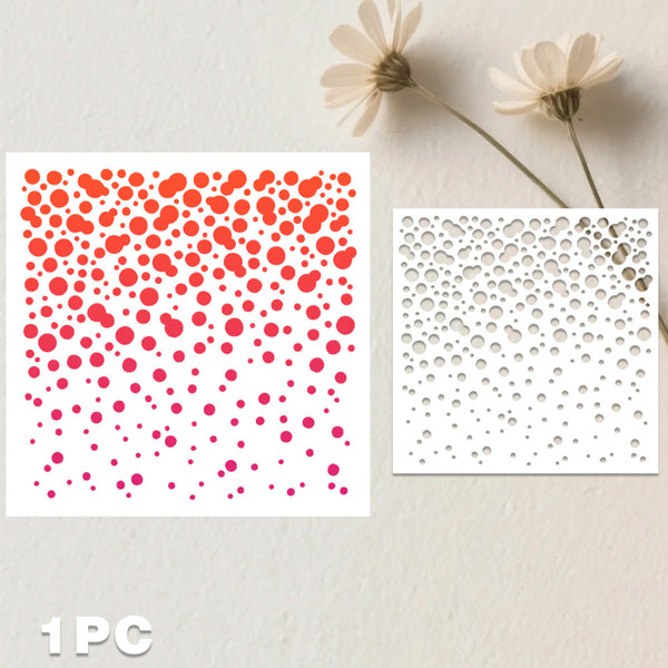 A stencil sheet with a gradient of red, orange, and pink dots on a white background, shown next to the cutout pattern on a light wall with dried flowers.