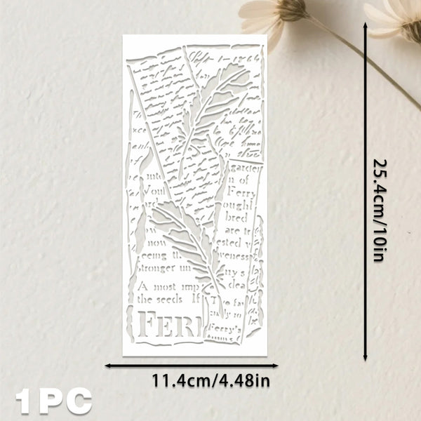 A white rectangular laser-cut paper ornament with a botanical leaf design and cursive text, shown with dimension lines indicating 11.4cm by 25.