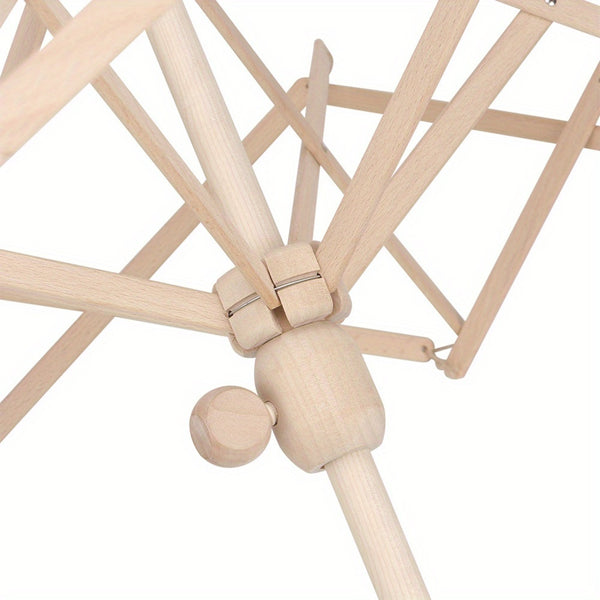 Close-up of a light natural wood folding umbrella frame showing the central joint, ribs, and base against a white background.