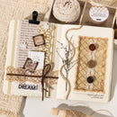 Decorative notebook with rustic elements on a textured surface