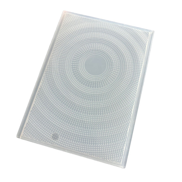 A clear, rectangular plastic cover with a circular textured pattern, shown at an angle on a white background.