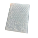 A clear plastic notebook cover with an embossed diamond lattice pattern and floral motifs along the bottom and left edges, shown on a plain white background.