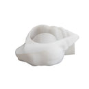 A white silicone mold designed for making soap, shaped like a clam shell with a smooth, rounded interior cavity, shown on a plain white background.