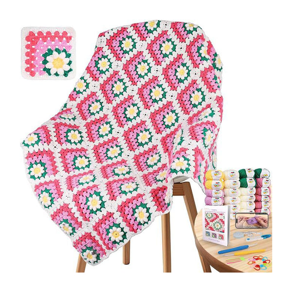 A colorful crocheted granny-square blanket draped over a wooden chair, shown with a small inset of the finished square pattern and a side table holding yarn skeins, a crochet hook, a pattern booklet, and other crafting accessories on a white background.