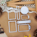 Set of metal cutting dies on a textured surface with decorative elements.