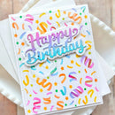 Colorful 'Happy Birthday' card with decorative patterns on a white background