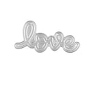 Metallic 'love' word charm on a white background