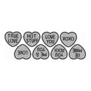 A set of heart-shaped decorative stickers or charms in light gray with black outlines and text, arranged on a plain white background. The hearts feature romantic phrases such as 'TRUE LOVE', 'HOT STUFF', 'LOVE YOU', 'XOXO', 'LOVE', 'ME & YOU', 'ROCK YOU', 'MINE', and 'BE MINE'.