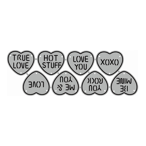 A set of heart-shaped decorative stickers or charms in light gray with black outlines and text, arranged on a plain white background. The hearts feature romantic phrases such as 'TRUE LOVE', 'HOT STUFF', 'LOVE YOU', 'XOXO', 'LOVE', 'ME & YOU', 'ROCK YOU', 'MINE', and 'BE MINE'.