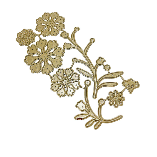 A gold-colored metal floral die-cut embellishment or craft template featuring snowflake-like blossoms and delicate leafy stems on a plain white background.
