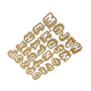A set of gold-colored metal alphabet letter cutters arranged diagonally on a plain white background.