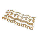 A gold-colored metal holiday wreath and garland die-cut template, featuring stars, acorns, leaves, and hanging ornaments, shown on a plain white background.