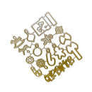 A set of gold-colored metal cookie cutters arranged in a diamond pattern on a plain white background. The cutters feature various festive holiday shapes including a Christmas tree, snowman, gingerbread man, reindeer, snow globe, and snowflake.