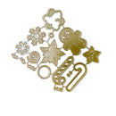 A set of gold-colored metal die-cut craft shapes, including a gingerbread man, snowflakes, a candy cane, a star, a swirl, and a cloud, arranged on a plain white background.