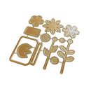 A set of gold-colored metal craft dies shaped like flowers, leaves, and a sun, arranged on a plain white background.