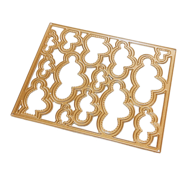 A rectangular gold metal decorative frame with an intricate openwork quatrefoil and floral pattern, shown on a plain white background.