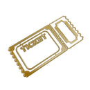 A gold-colored metal die-cut ticket template with scalloped edges and the word 'TICKET' embossed on one side, shown on a plain white background.