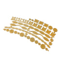 A set of gold-colored metal craft dies with various geometric and organic shapes, arranged diagonally on a plain white background.