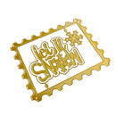 Gold metal die-cut embellishment featuring the phrase 'Let It Snow' in stylized lettering with snowflake motifs, shown on a plain white background.