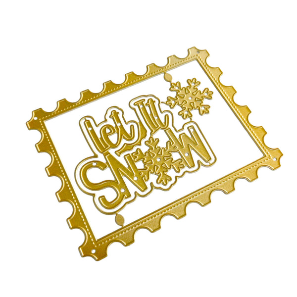 Gold metal die-cut embellishment featuring the phrase 'Let It Snow' in stylized lettering with snowflake motifs, shown on a plain white background.