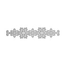 A silver metal die-cut decorative border featuring intricate snowflake and scroll patterns, shown on a plain white background.