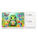 A spiral-bound desk calendar shown open to a colorful illustrated cover featuring a green turtle character holding a cup, surrounded by flowers and butterflies, with two monthly calendar pages visible on the right against a plain white background.