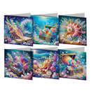 Six diamond painting cards featuring vibrant underwater treasure scenes with seashells, pearls, coral, and glowing gems, arranged in two rows on a white background.