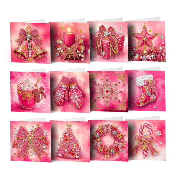 A set of 12 Christmas-themed greeting cards arranged in a 3x4 grid, featuring festive illustrations like bells, a candle, a gift box, a star, a mug of hot chocolate, knit mittens, a snowflake, a stocking, a wreath, a Christmas tree, and a candy cane, all in a pink and gold color scheme.