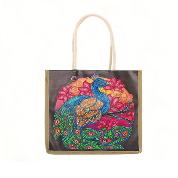 A canvas tote bag with a dark brown body, beige handles and trim, featuring a vibrant, colorful beaded peacock and floral design on the front.