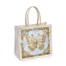 Decorative tote bag with a gold butterfly design on a white background